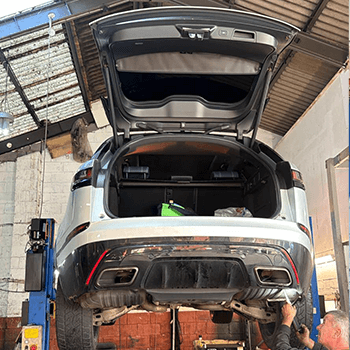 Vehicle on workshop lift